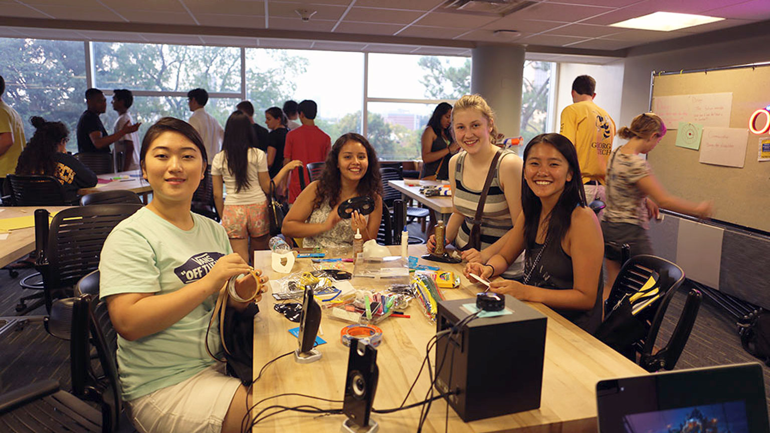 A table full of students build physical low-fidelity prototypes during a workshop in Design Bloc's GT-1000 course. 