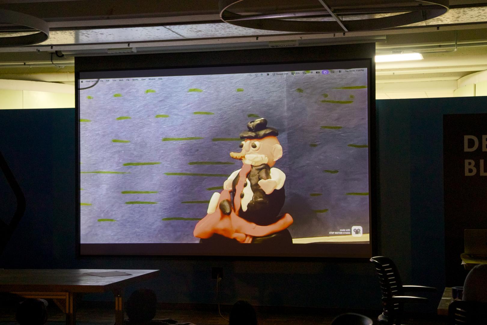 Movie Screen showing a clay motorcycle and rider